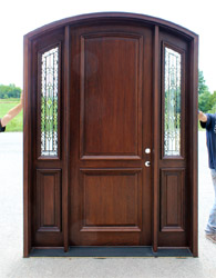 Arched Bellagio Door with iron classic sidelights